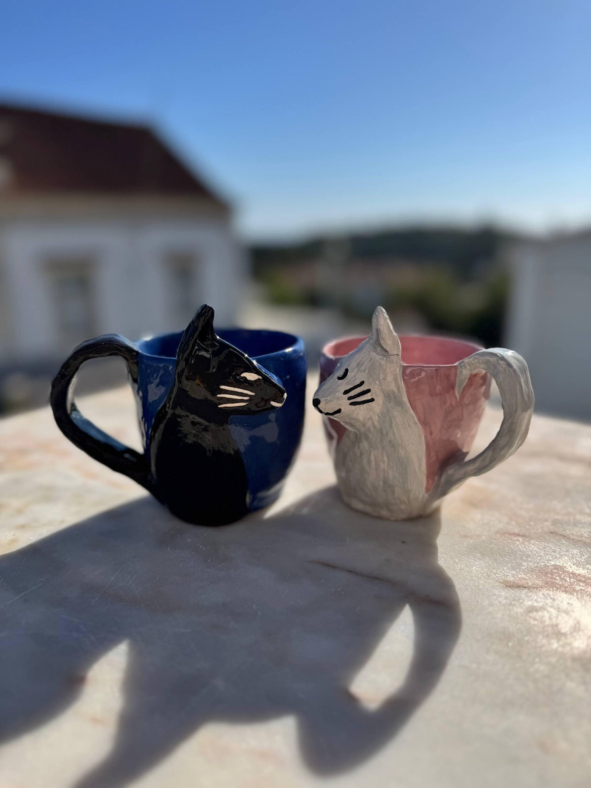 Black and pink hand-painted cat mugs