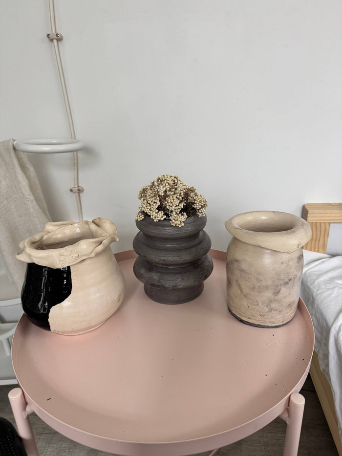 Finished pieces out of the kiln on a studio table