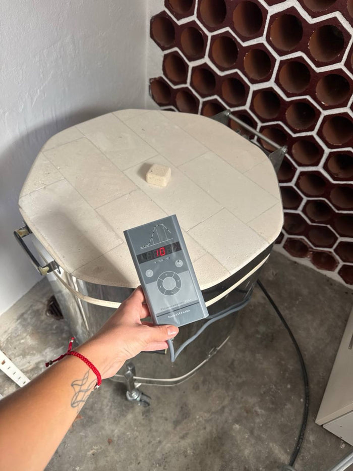 Maria setting the controller of her own kiln